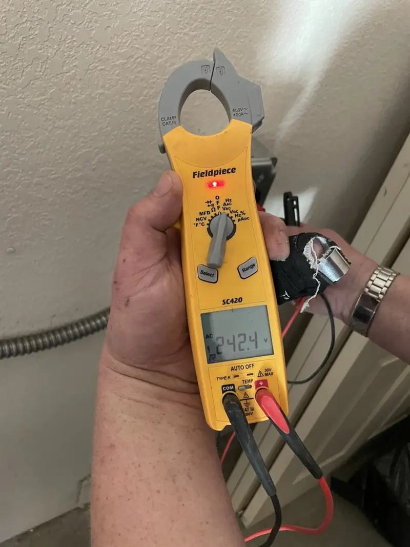 Voltage testing with clamp meter during Ceiling Fan Installation in Hartford